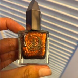 Glittery Orange Nail Polish